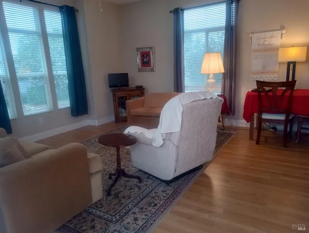 a kitchen with granite countertop cabinets stainless steel appliances and a sink