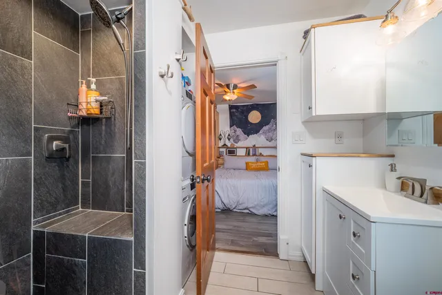 a bathroom with a toilet and a shower