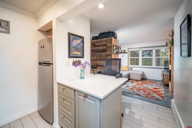 a room that has a bed and a table in it