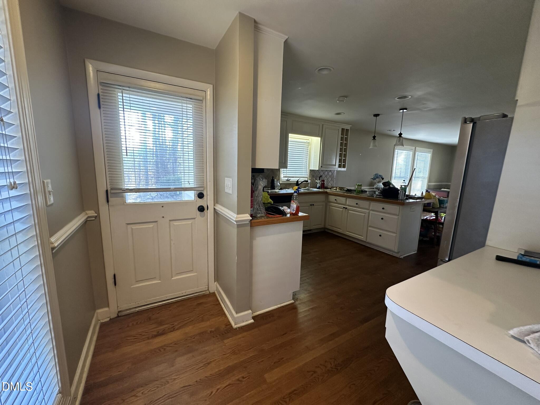 7208 Eastover Drive Raleigh, NC 27603 - Photo 14 of 41 a kitchen with sink a refrigerator and wooden floor