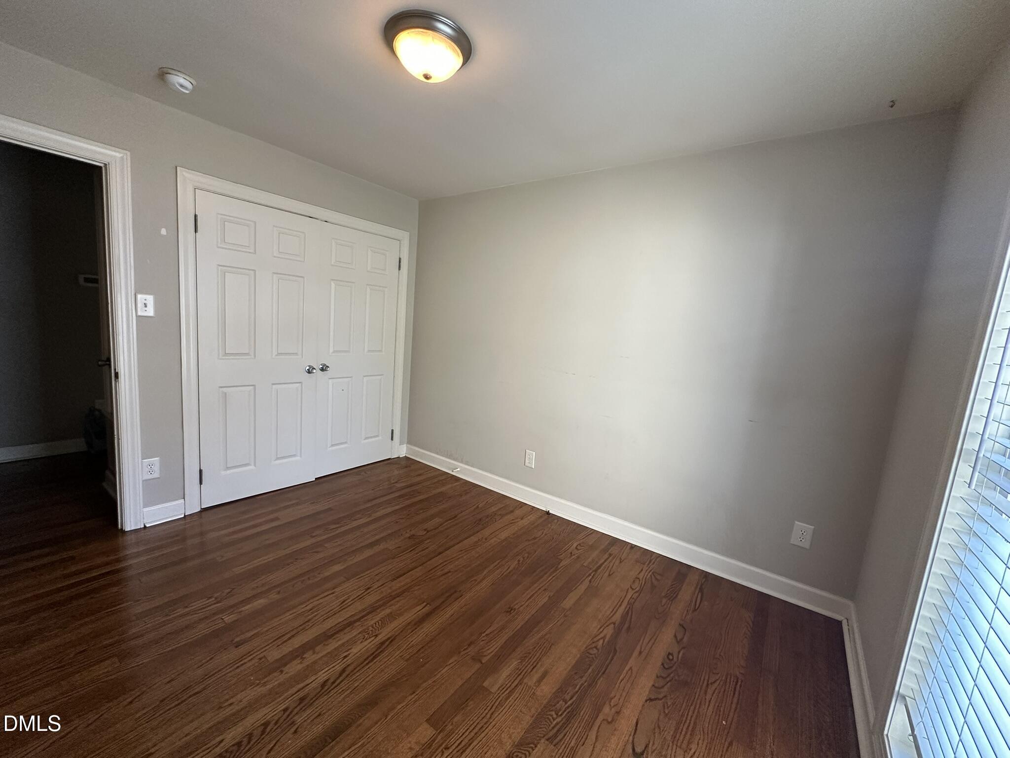 7208 Eastover Drive Raleigh, NC 27603 - Photo 22 of 41 a view of an empty room with wooden floor