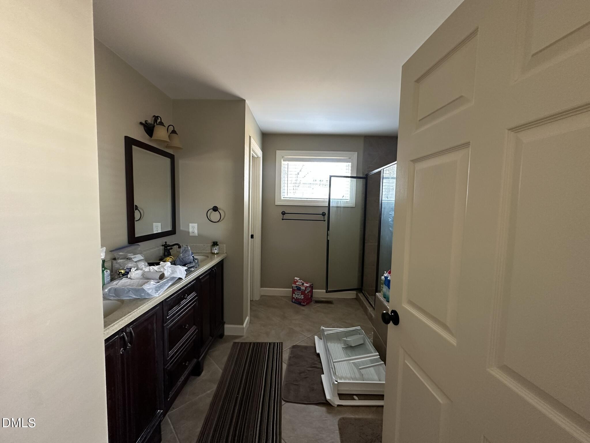7208 Eastover Drive Raleigh, NC 27603 - Photo 26 of 41 a bathroom with a sink mirror and toilet
