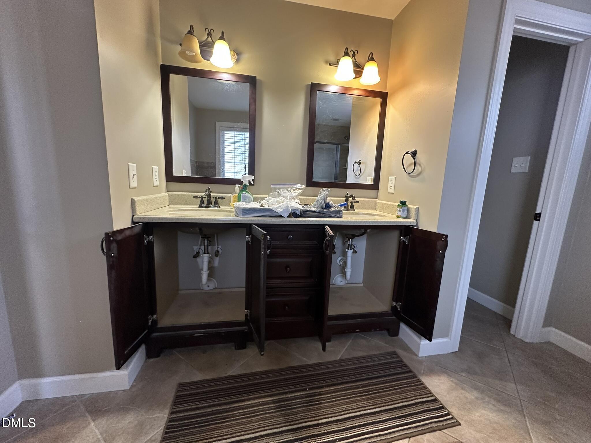 7208 Eastover Drive Raleigh, NC 27603 - Photo 28 of 41 a view of a bathroom sink and mirror