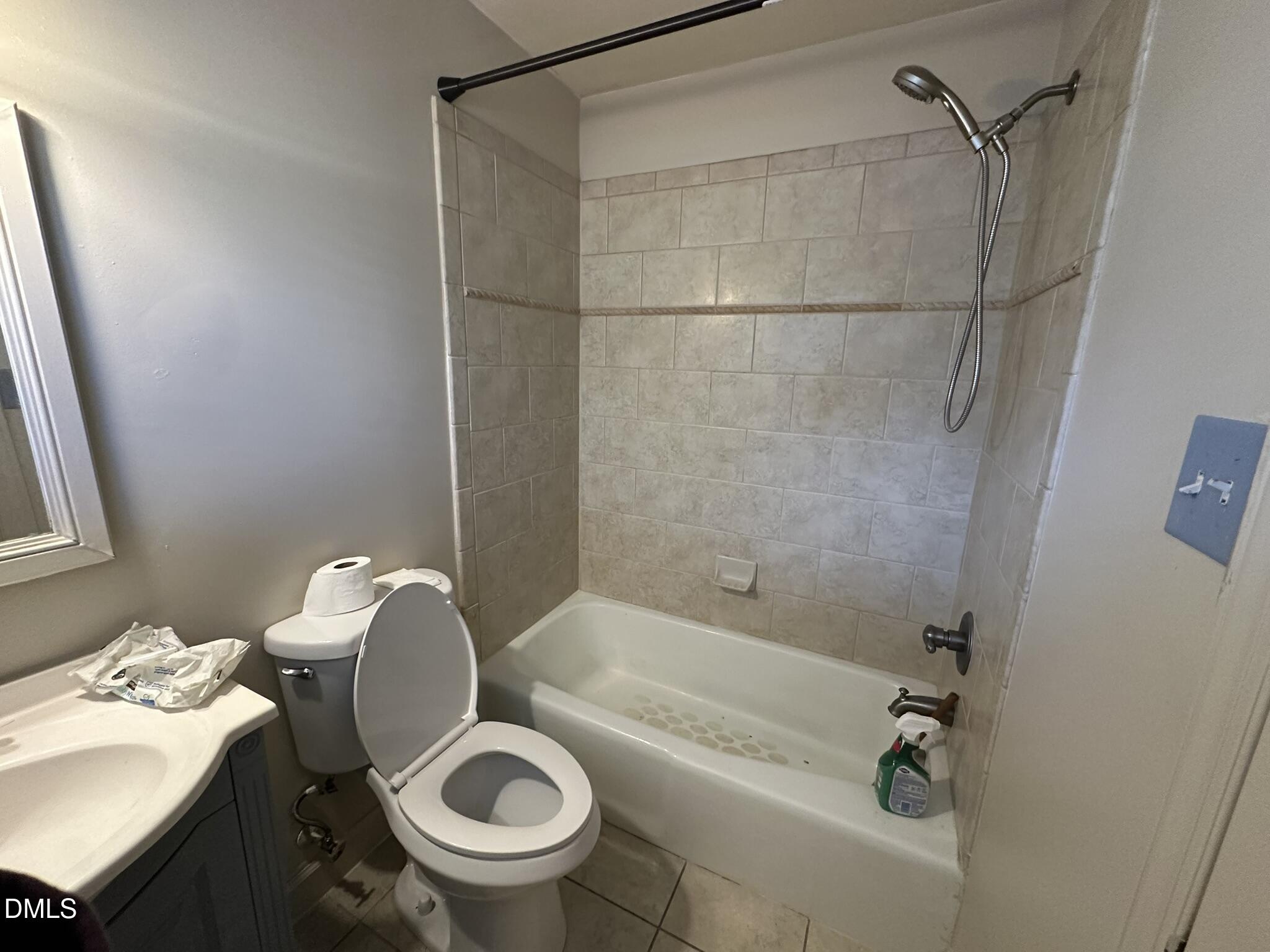 7208 Eastover Drive Raleigh, NC 27603 - Photo 32 of 41 a bathroom with a sink a toilet and a bathtub