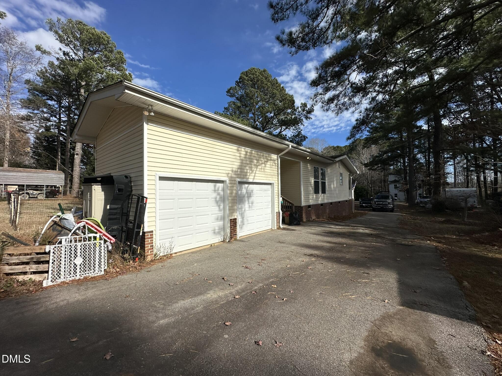 7208 Eastover Drive Raleigh, NC 27603 - Photo 35 of 41 a view of a house with a yard and garage