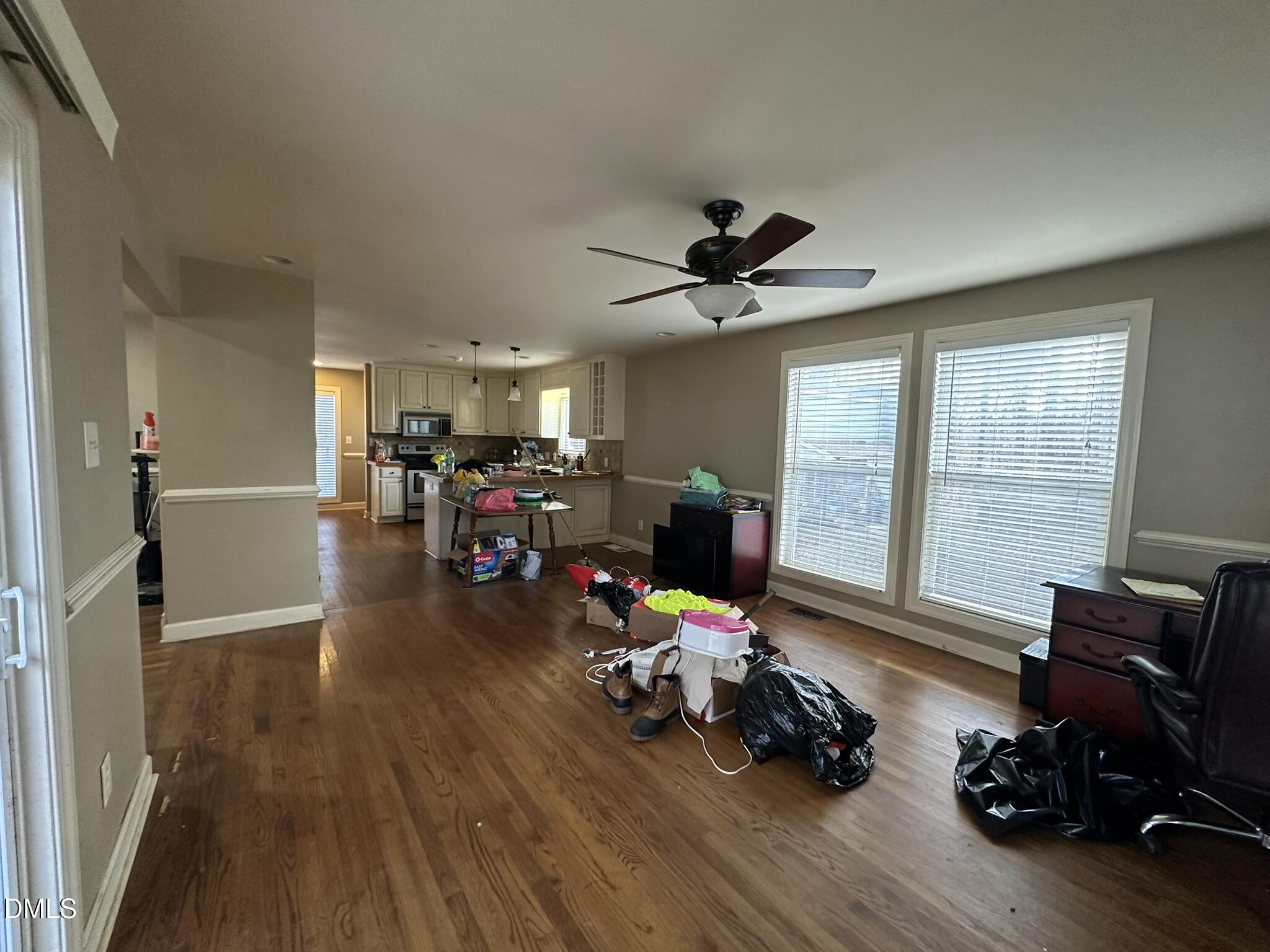 7208 Eastover Drive Raleigh, NC 27603 - Photo 8 of 41 a living room with furniture and wooden floor