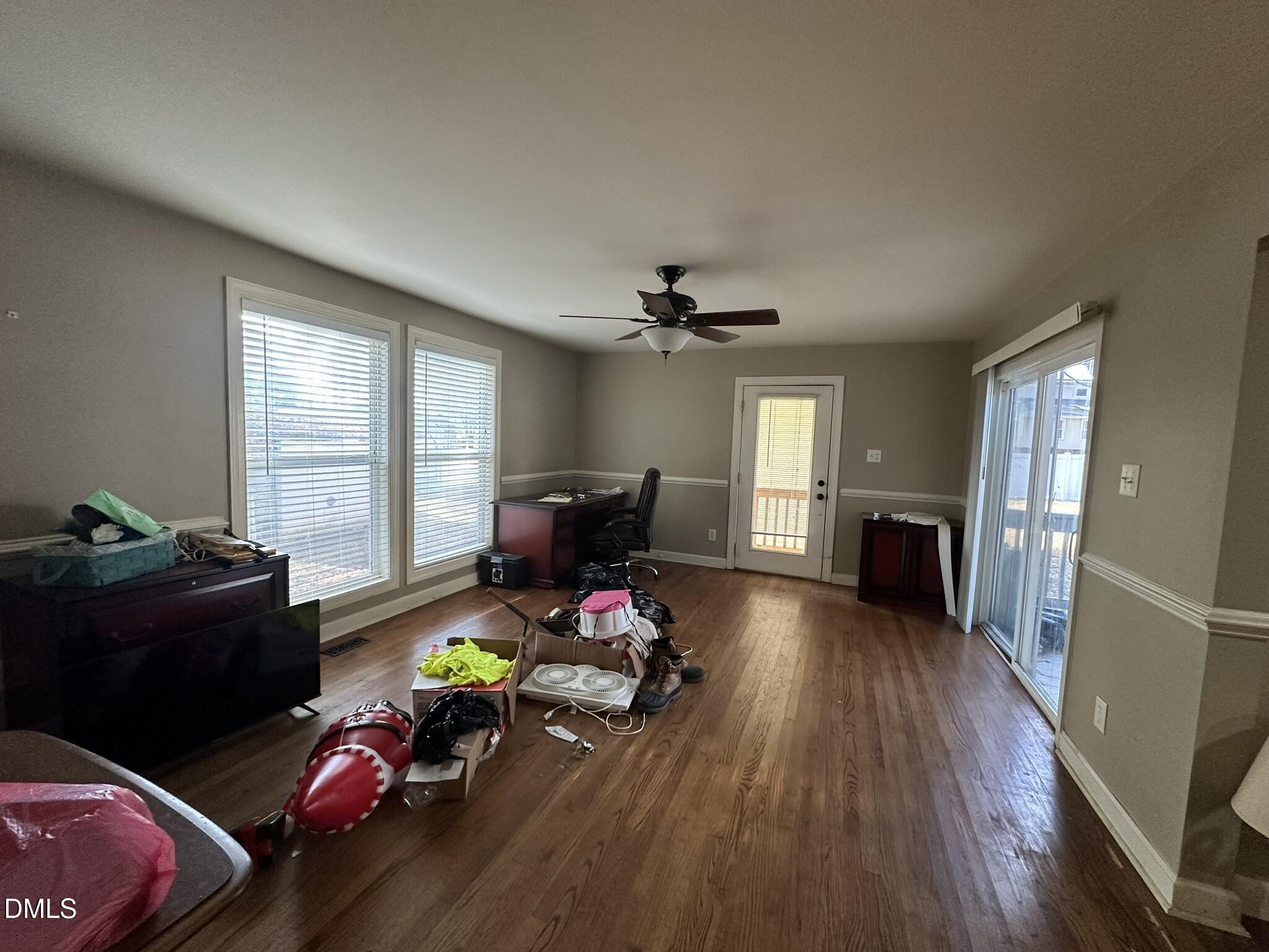 7208 Eastover Drive Raleigh, NC 27603 - Photo 10 of 41 a living room with furniture and a wooden floor