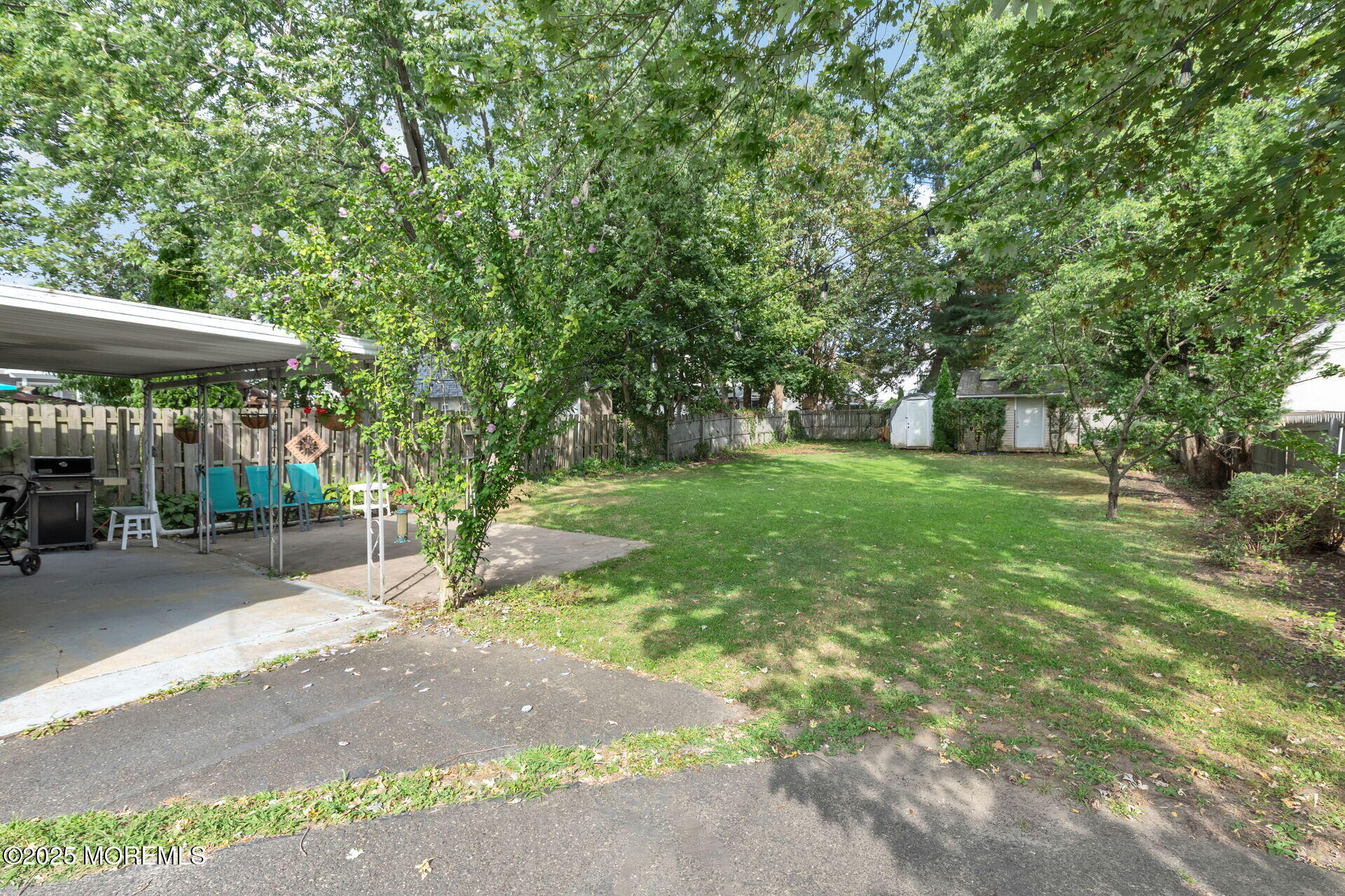 301 Norwood Avenue, Unit 3 Long Branch, NJ 07740 - Photo 11 of 17 a view of a patio with a table and chairs under an umbrella