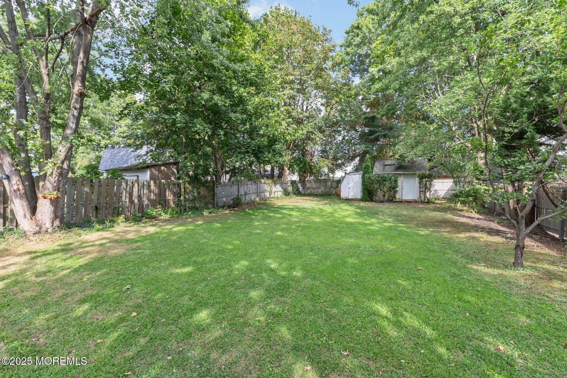 301 Norwood Avenue, Unit 3 Long Branch, NJ 07740 - Photo 16 of 17 a view of a backyard with large trees