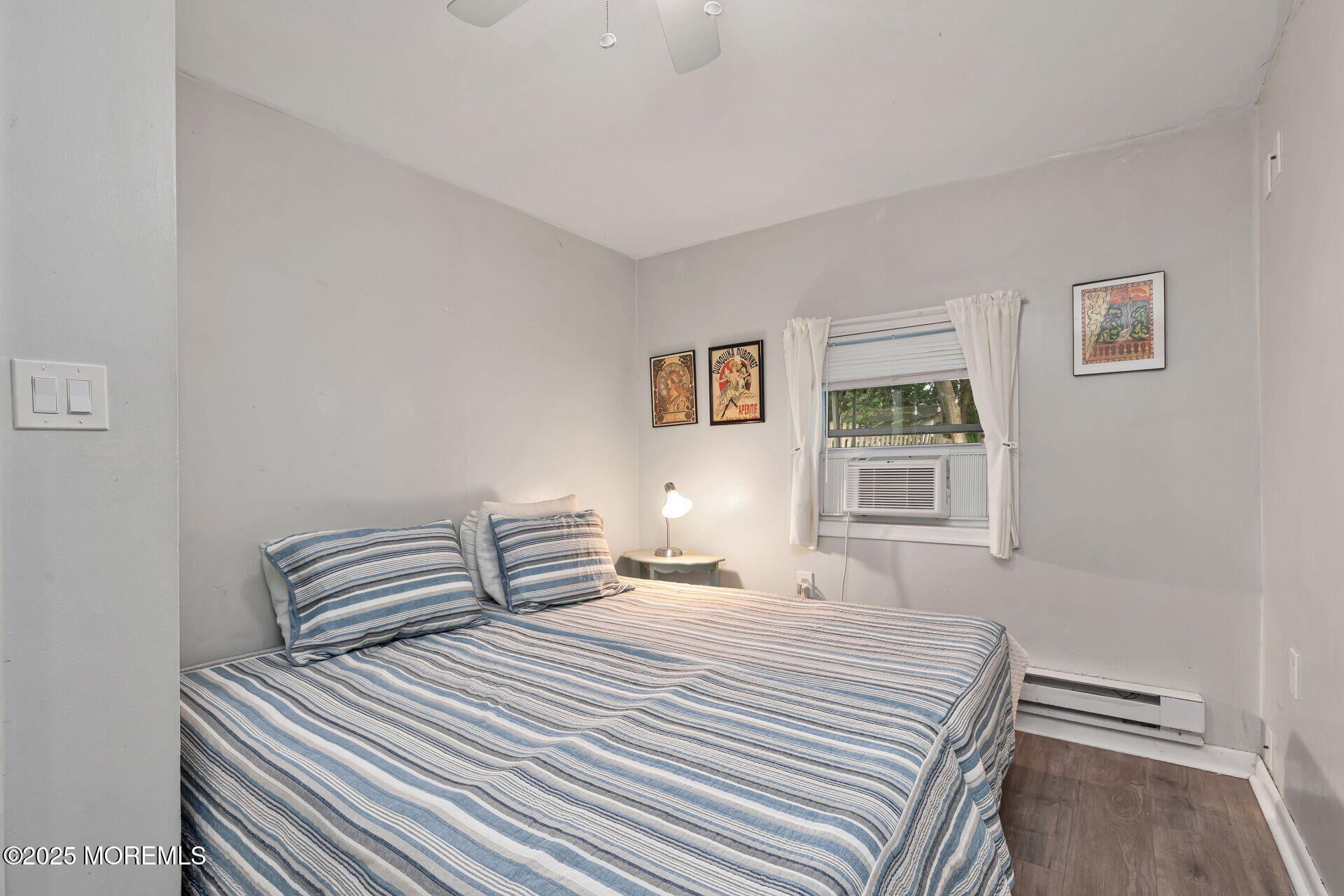 301 Norwood Avenue, Unit 3 Long Branch, NJ 07740 - Photo 9 of 17 a bedroom with a bed and a window