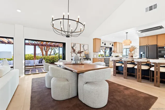 a living room with furniture fireplace and a large window