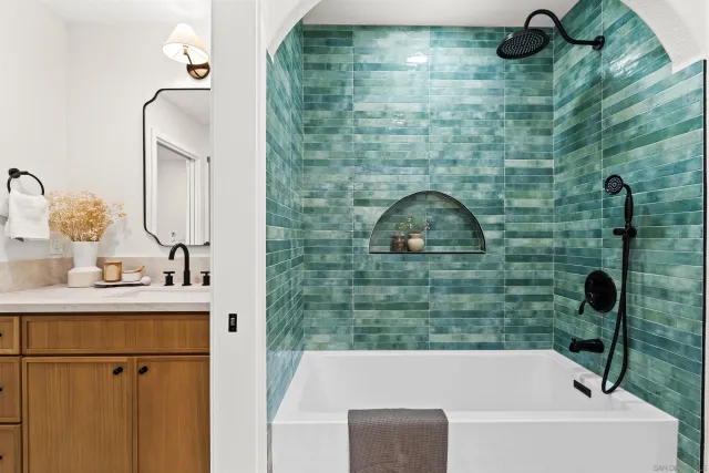 a view of a patio with table and chairs potted plants and floor to ceiling window