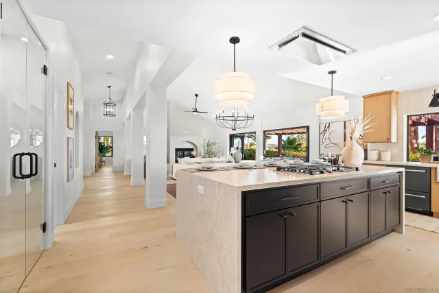 a kitchen with a sink a stove and a refrigerator
