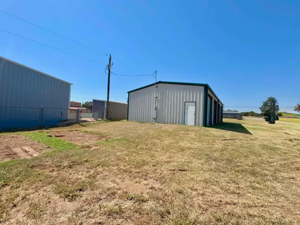a view of a yard with an outdoor space