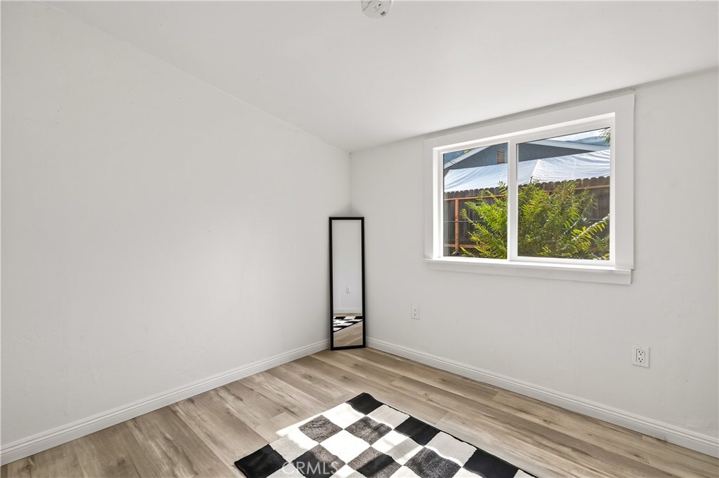 17653 Raley Avenue Lake Elsinore, CA 92530 - Photo 12 of 29 an empty room with window