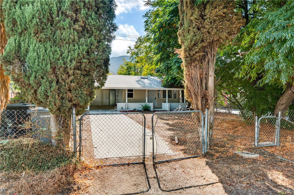17653 Raley Avenue Lake Elsinore, CA 92530 - Photo 29 of 29 a front view of a house with a yard