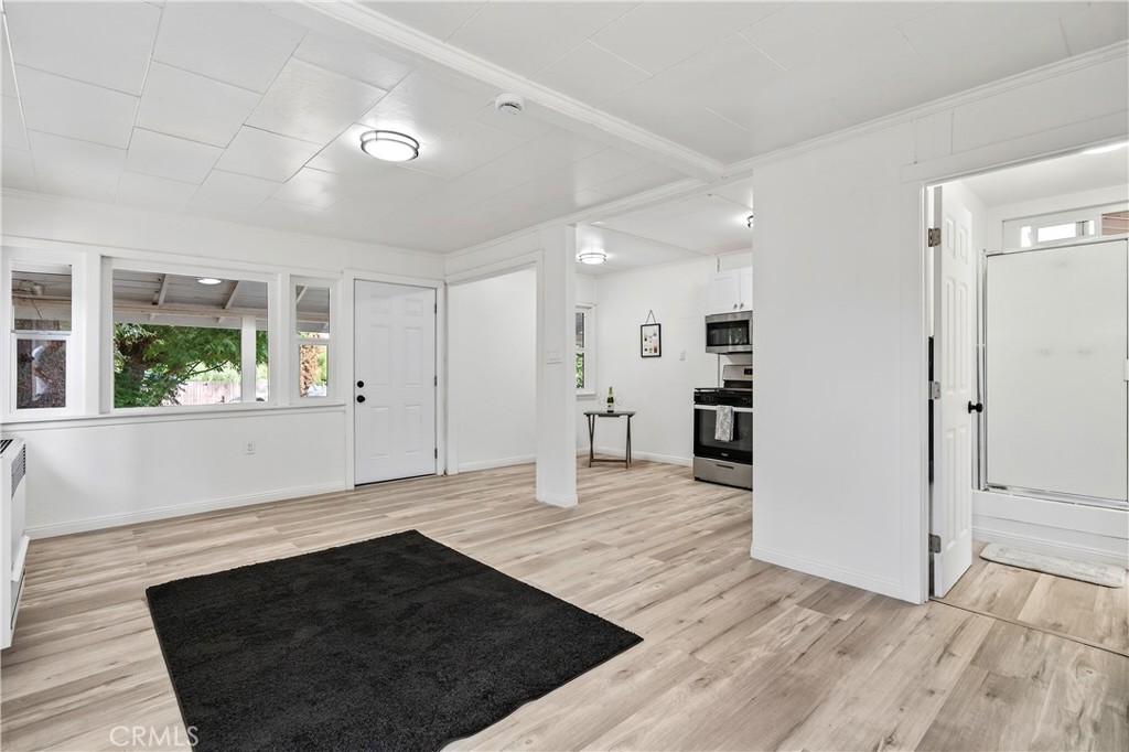 17653 Raley Avenue Lake Elsinore, CA 92530 - Photo 5 of 29 wooden floor in an empty room with a window