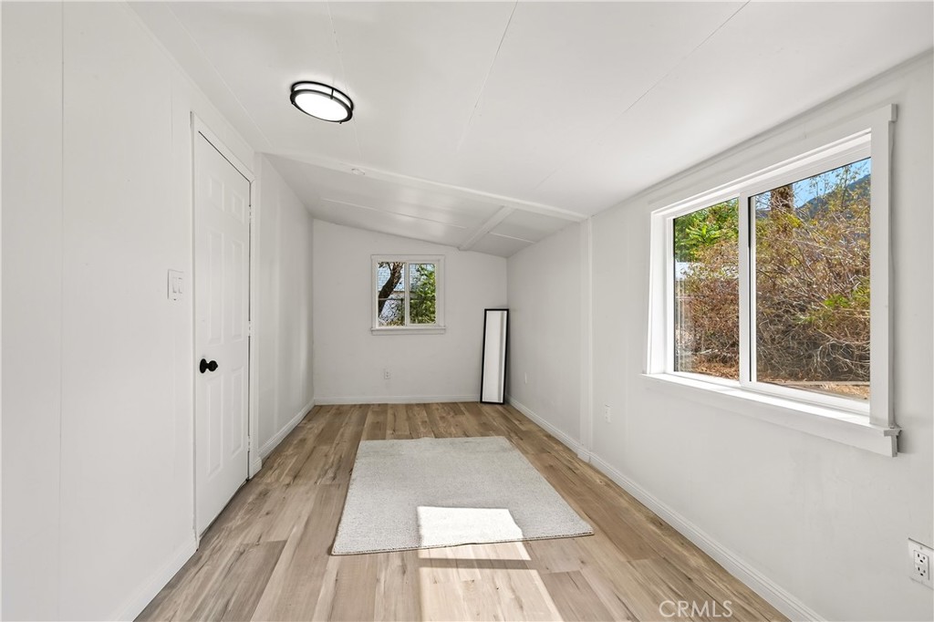 17653 Raley Avenue Lake Elsinore, CA 92530 - Photo 10 of 29 a view of an empty room with a window