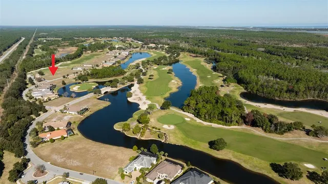 an aerial view of a residential houses with outdoor space
