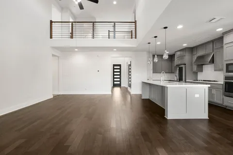 a view of kitchen with cabinets and wooden floor