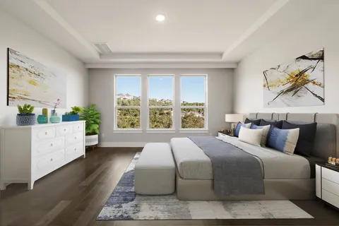 a bedroom with a large bed and a window