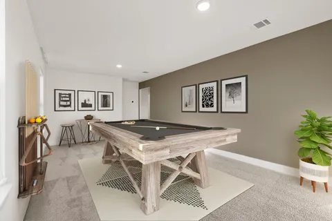 a view of a livingroom with furniture and a potted plant