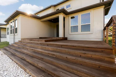 a front view of a house with a street