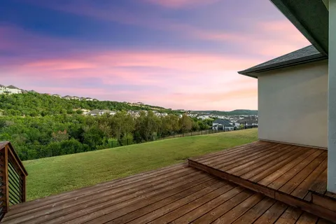 a view of a yard from a balcony