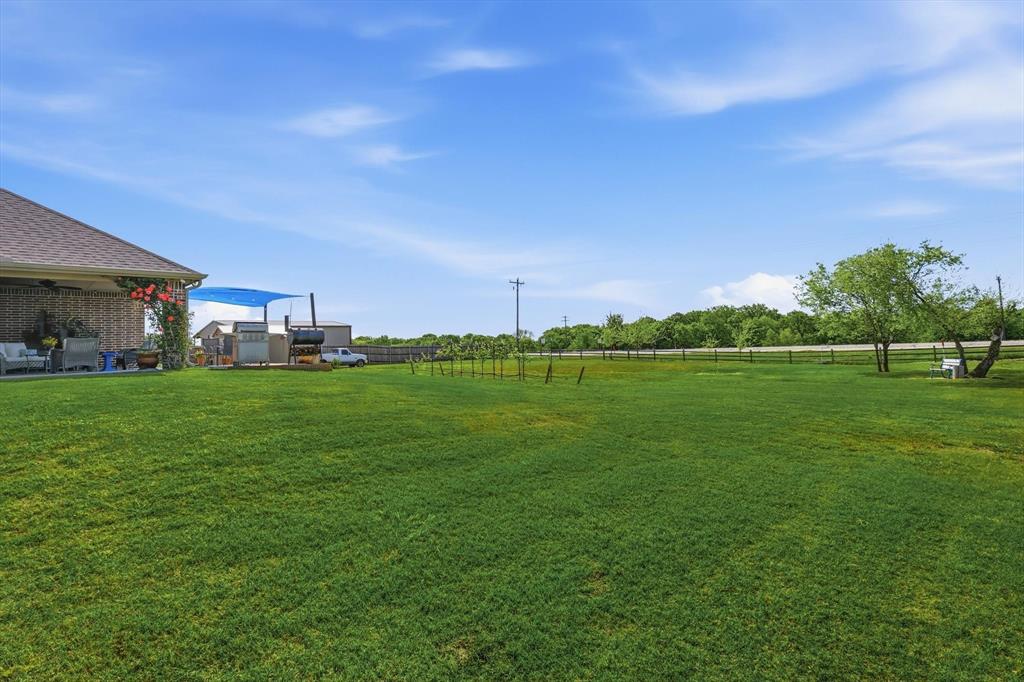 113 Heather Lane Decatur, TX 76234 - Photo 29 of 32 a view of a green field with sitting area