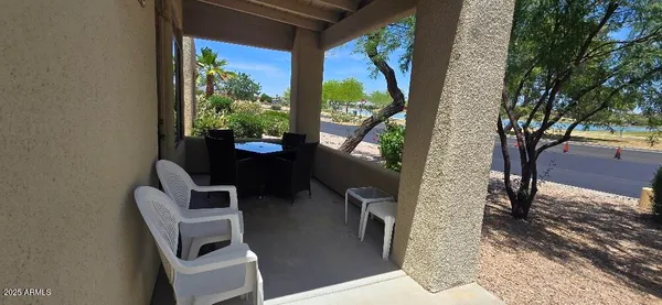 a view of balcony with couple of chairs