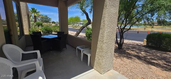 a view of balcony with two chairs and a table