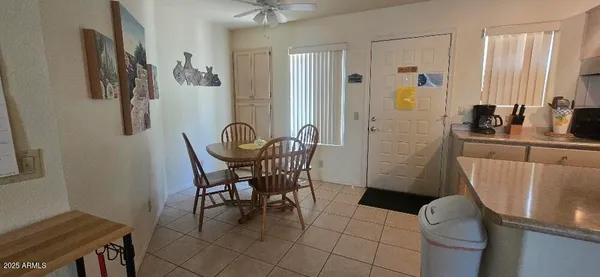 a dining room with furniture and window