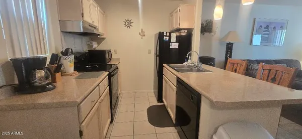 a bathroom with a granite countertop sink a toilet and a mirror