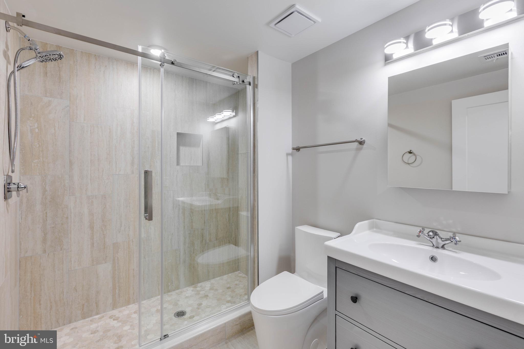 1434 Parrish Street, Unit B Philadelphia, PA 19130 - Photo 15 of 17 a bathroom with a sink toilet and shower