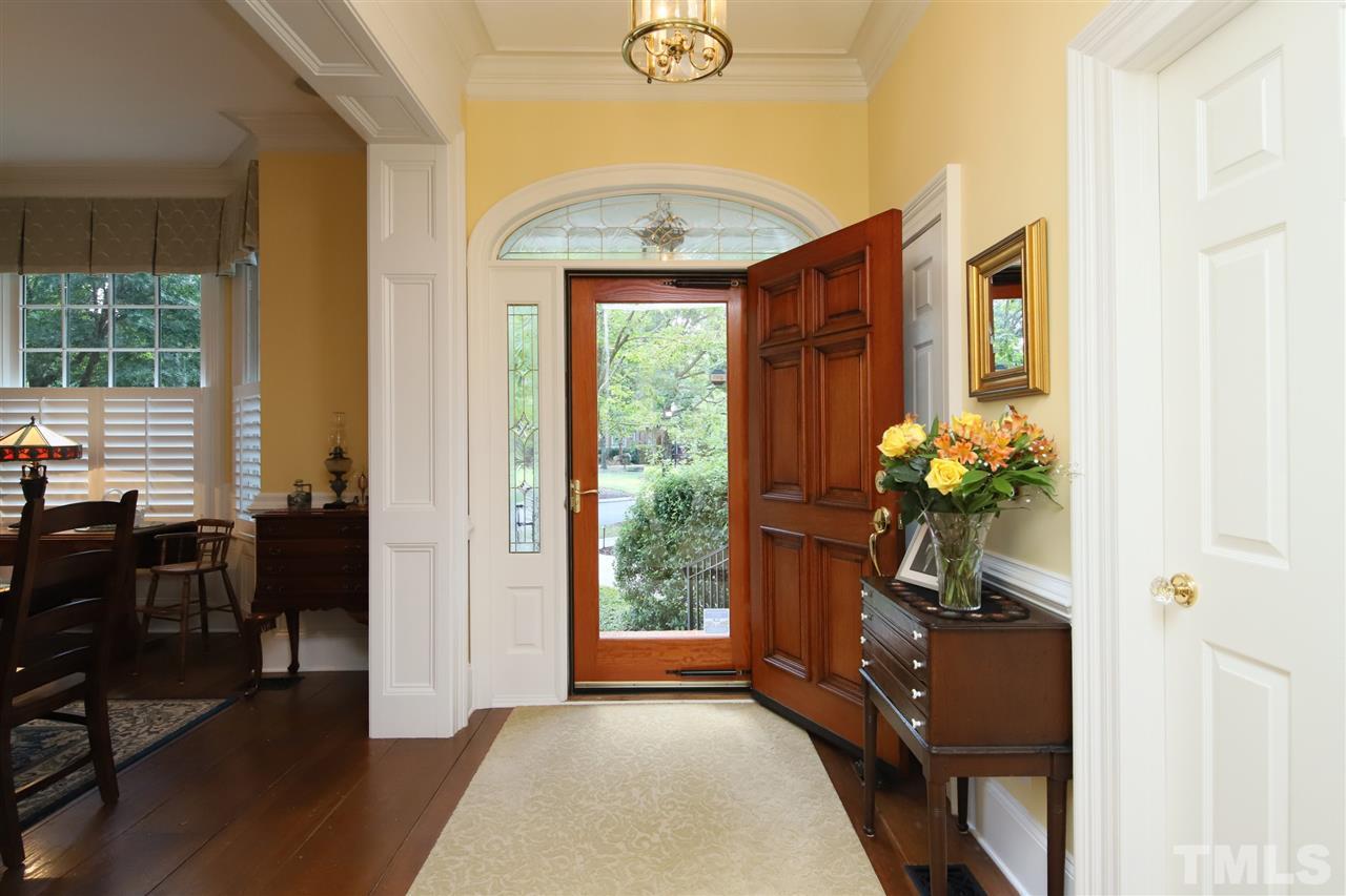 207 Oval Park Place Chapel Hill, NC 27517 - Photo 2 of 30 The gracious foyer looks out onto the park with its fountain.