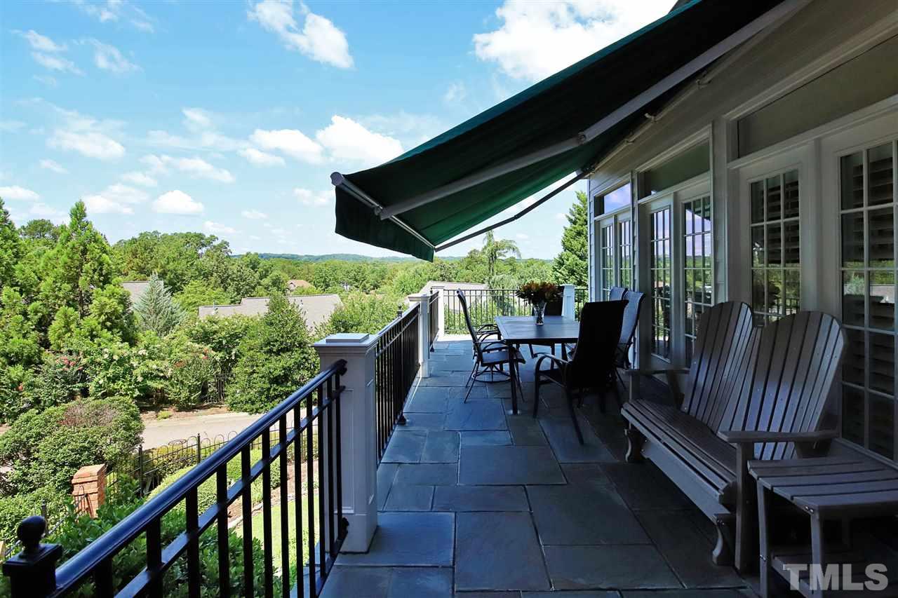 207 Oval Park Place Chapel Hill, NC 27517 - Photo 11 of 30 The deck on the main level features a retractable awning, with wonderful western views towards the UNC campus and incredible sunsets.