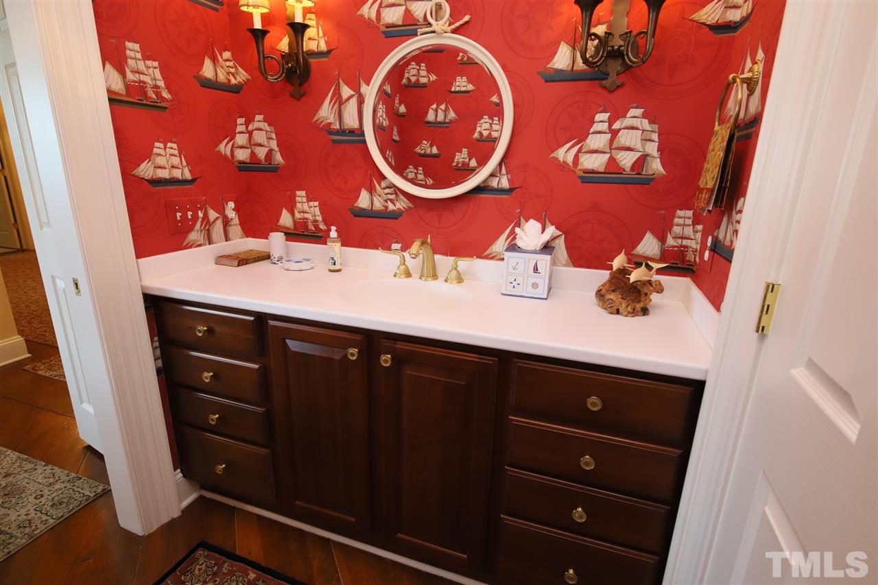 207 Oval Park Place Chapel Hill, NC 27517 - Photo 18 of 30 A second half bath adjoins the media room on the second floor.