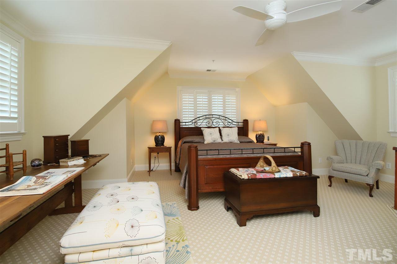 207 Oval Park Place Chapel Hill, NC 27517 - Photo 19 of 30 This large bedroom is above the master bedroom on the first floor and features a private bathroom and two closets.