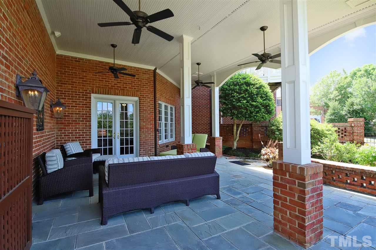 207 Oval Park Place Chapel Hill, NC 27517 - Photo 27 of 30 The private patio features four ceiling fans and adjoins a lovely fenced garden at the rear of the home.