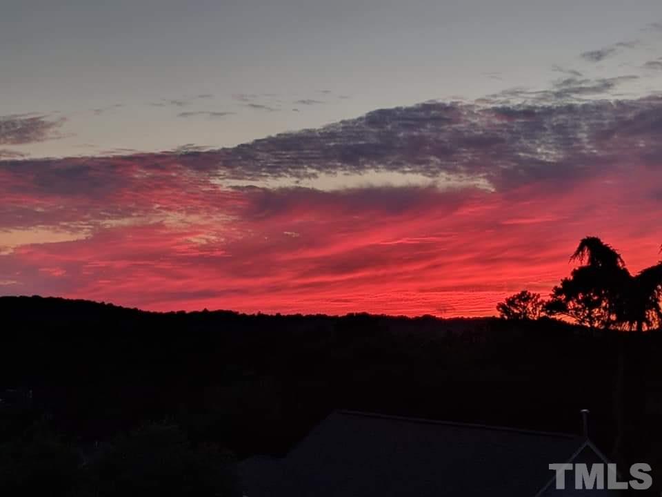 207 Oval Park Place Chapel Hill, NC 27517 - Photo 30 of 30 A view of the sunset in the western sky from the main level deck of 207 Oval Park Place.