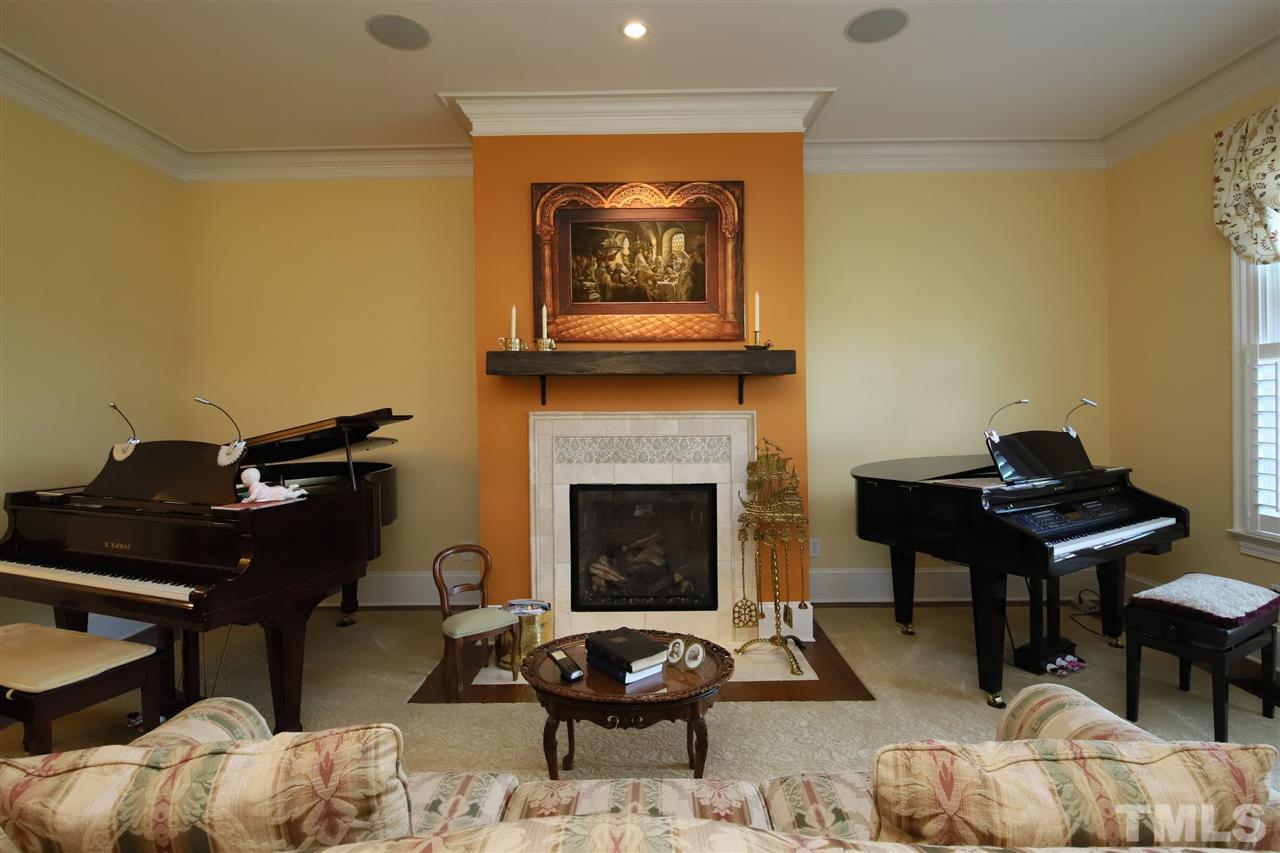 207 Oval Park Place Chapel Hill, NC 27517 - Photo 8 of 30 The spacious living room features a gas log fireplace that was completely rebuilt with a new tile surround and mantle.