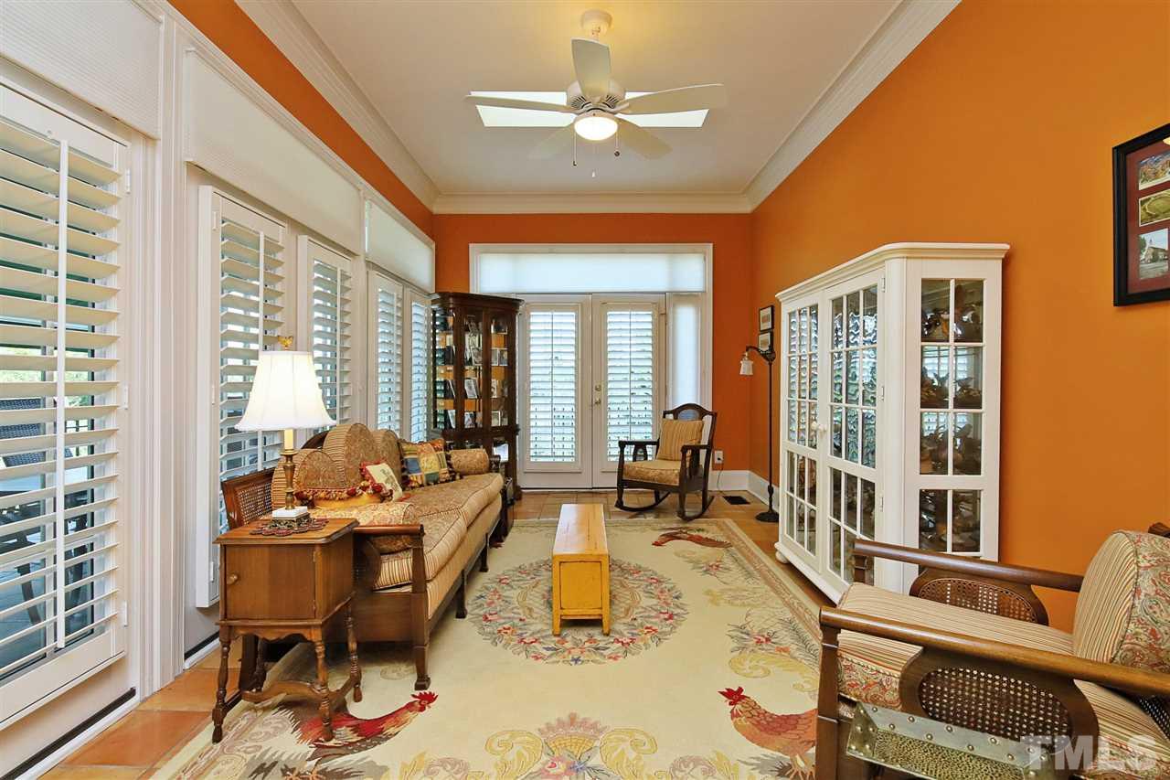 207 Oval Park Place Chapel Hill, NC 27517 - Photo 10 of 30 The sun room is off the living room; both rooms open onto the main level deck with its incredible views.