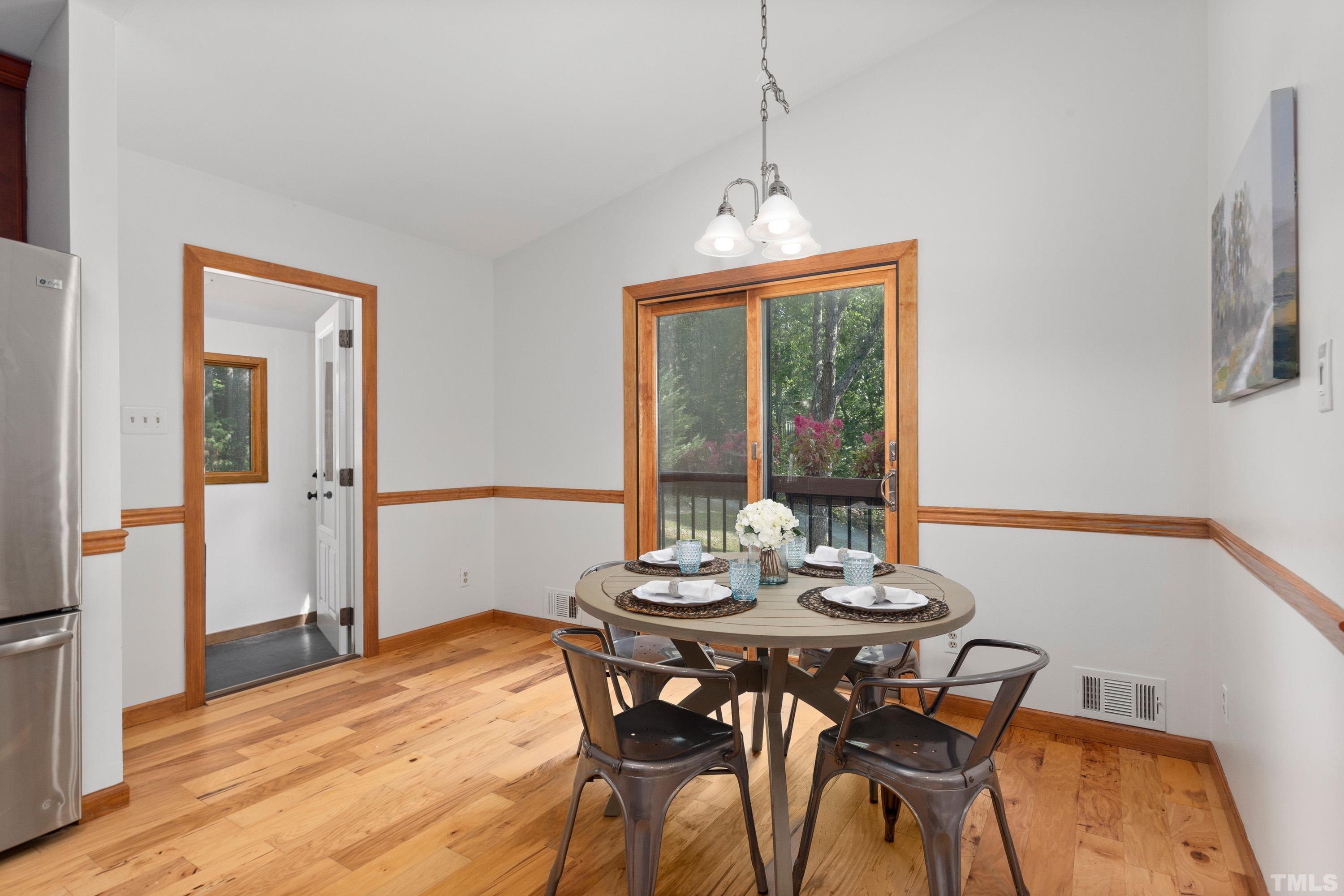 2600 Ferrand Drive Durham, NC 27705 - Photo 13 of 67 a view of a dining room with furniture window and wooden floor