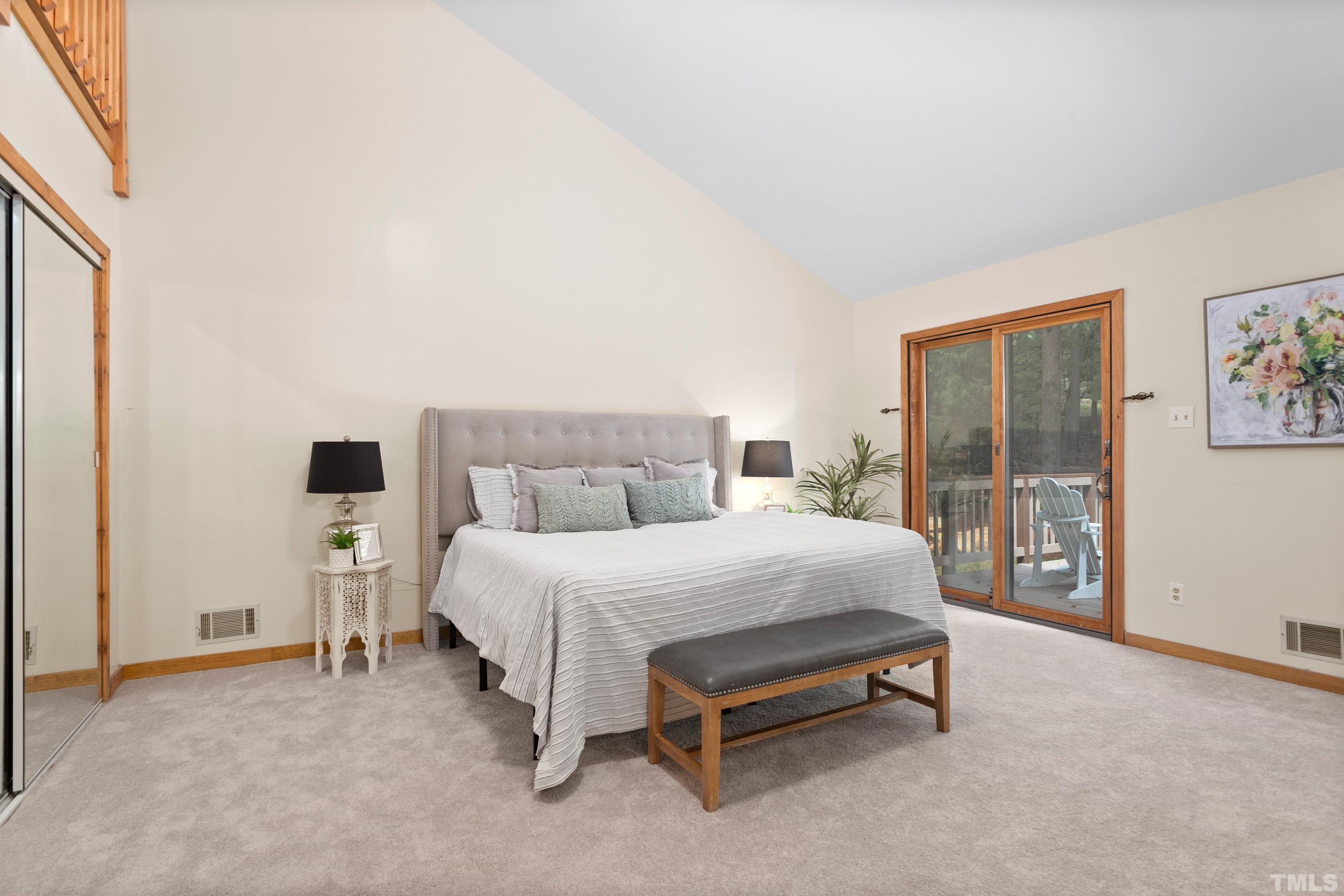 2600 Ferrand Drive Durham, NC 27705 - Photo 15 of 67 a spacious bedroom with a bed and large window