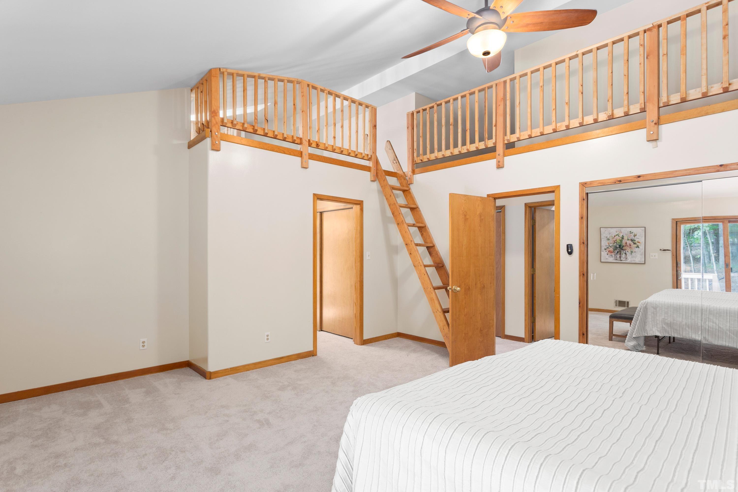 2600 Ferrand Drive Durham, NC 27705 - Photo 16 of 67 a bedroom with a bed and wooden floor