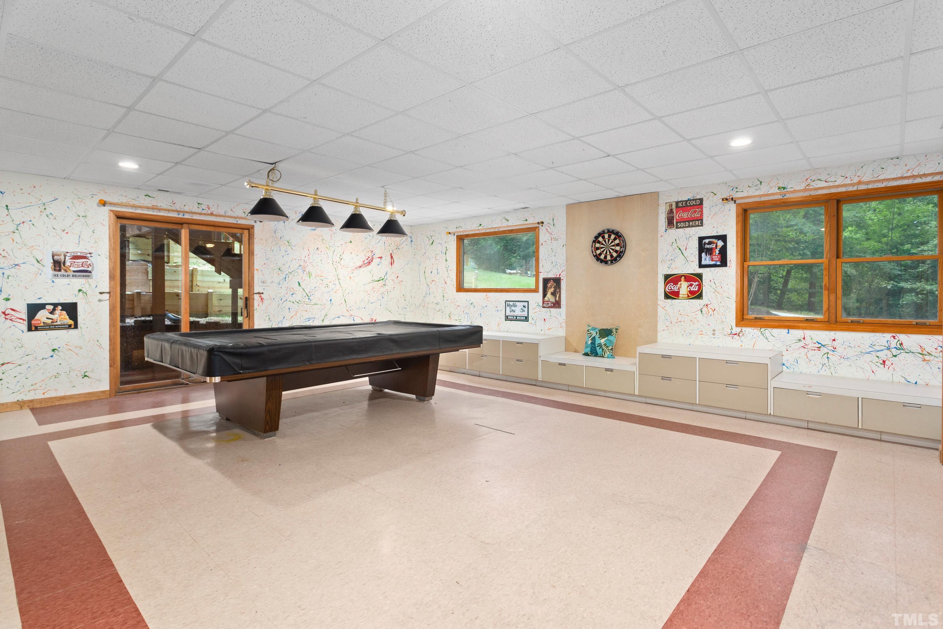 2600 Ferrand Drive Durham, NC 27705 - Photo 31 of 67 a living room with furniture a table and a large window