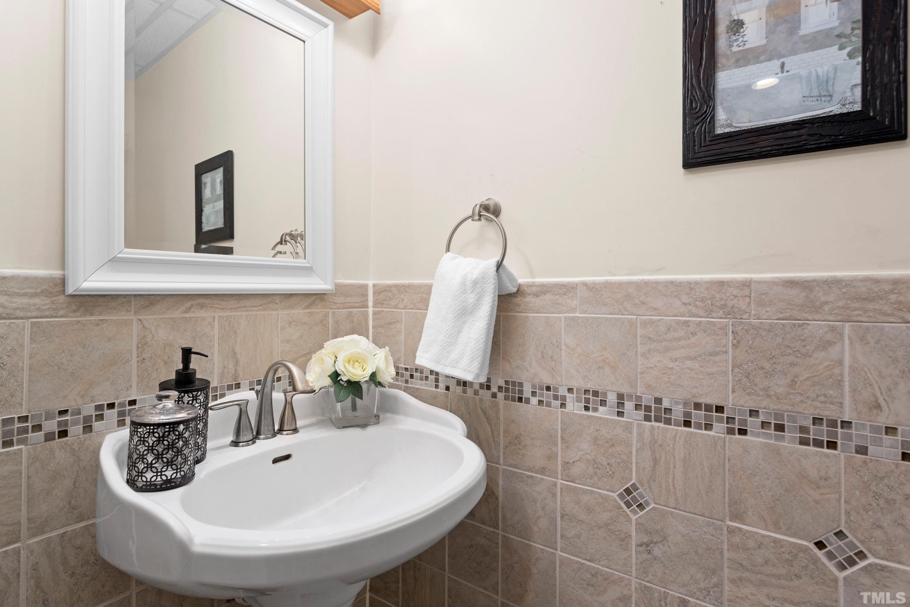 2600 Ferrand Drive Durham, NC 27705 - Photo 33 of 67 a bathroom with a sink and a mirror