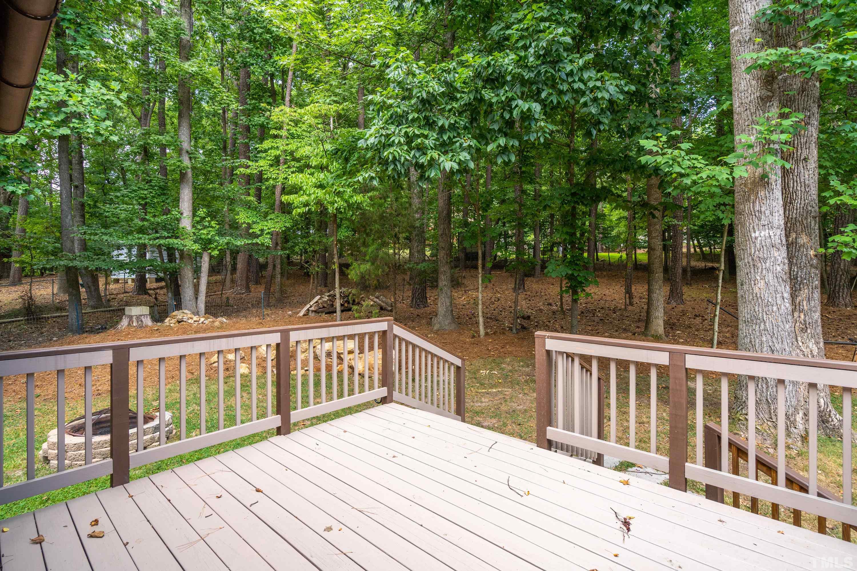 2600 Ferrand Drive Durham, NC 27705 - Photo 39 of 67 a balcony with wooden floor and yard in the back