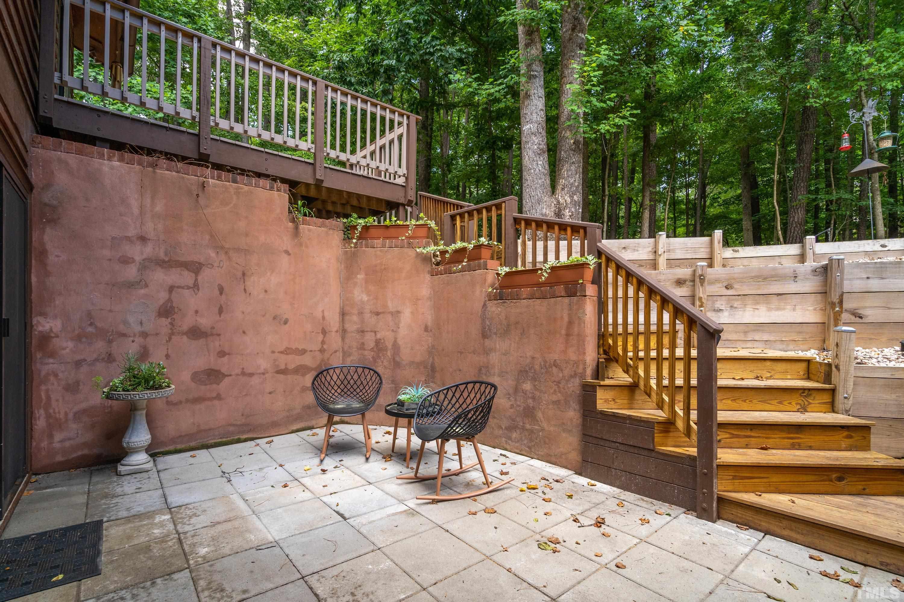 2600 Ferrand Drive Durham, NC 27705 - Photo 42 of 67 a view of a patio with a table and chairs