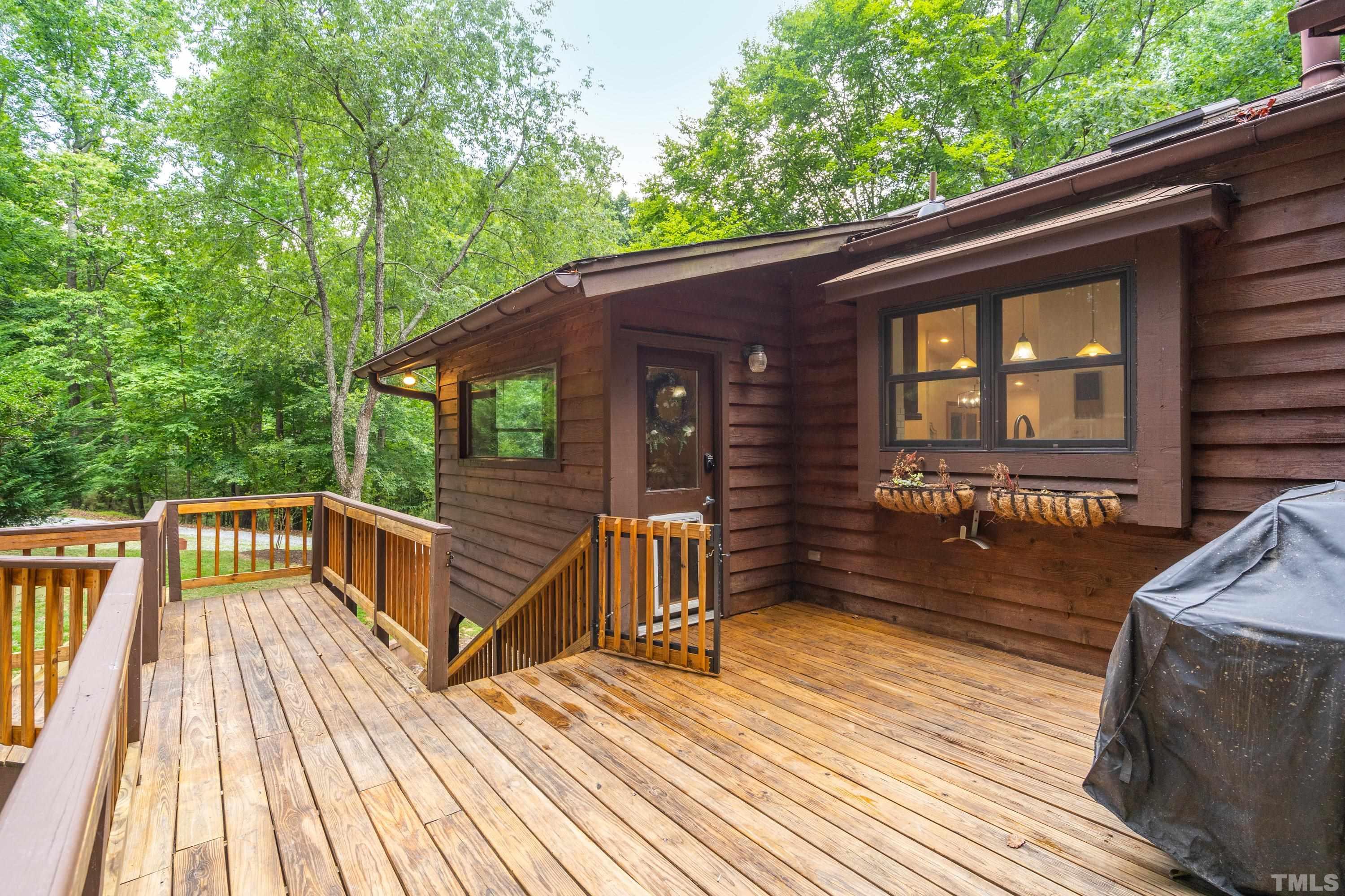 2600 Ferrand Drive Durham, NC 27705 - Photo 43 of 67 a view of a wooden deck with a yard